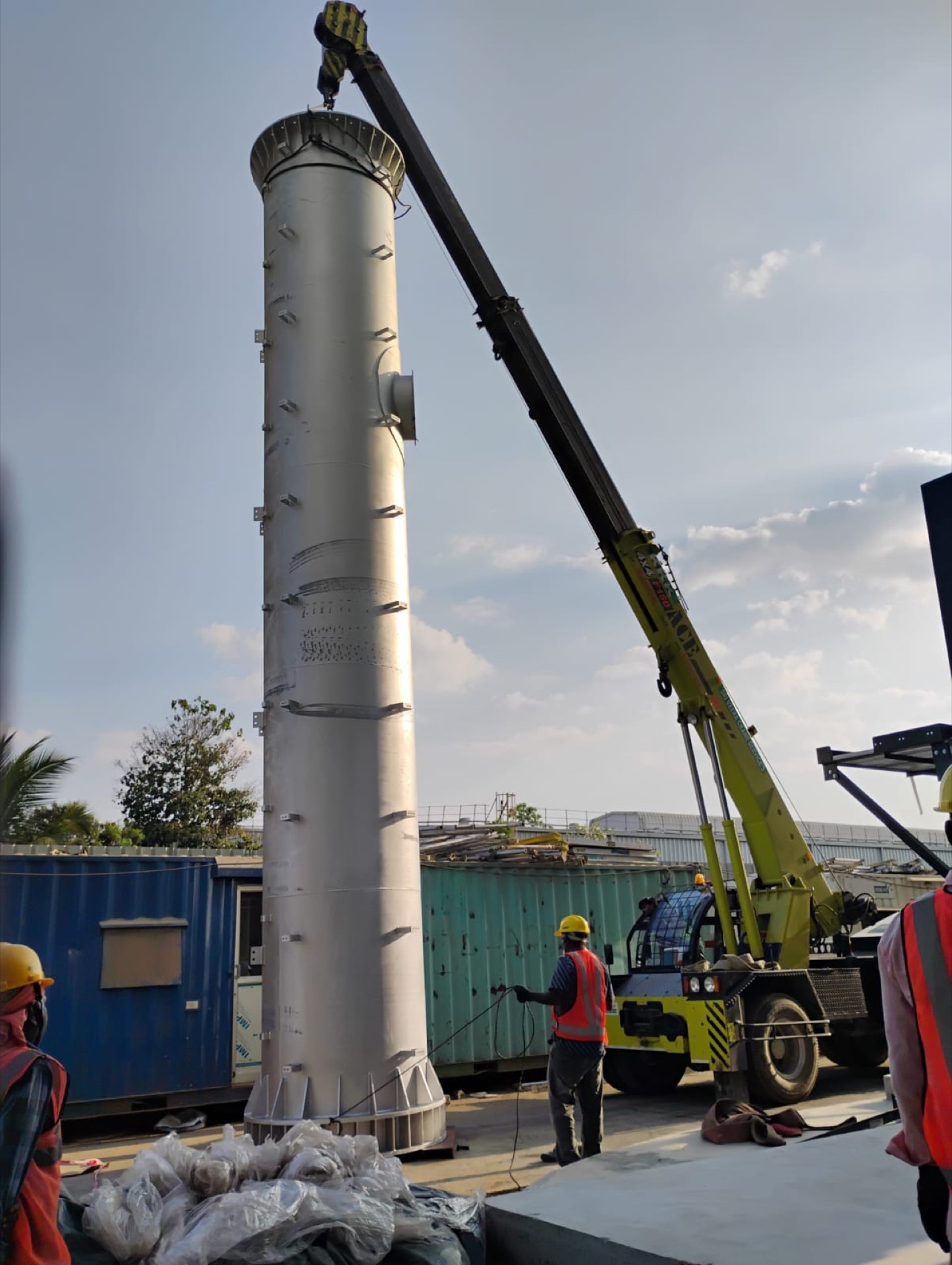 crane lifting, crew visible